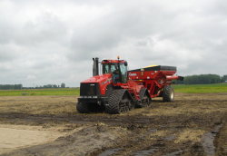 Soil compaction caused by heavy machinery under wet field conditions
